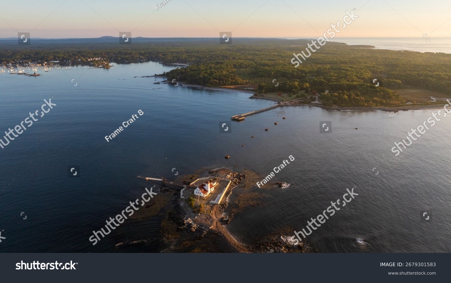stock-photo-a-historic-life-saving-station-sits-on-a-small-island-near-the-mainland-surrounded-by-calm-coastal-2679301583